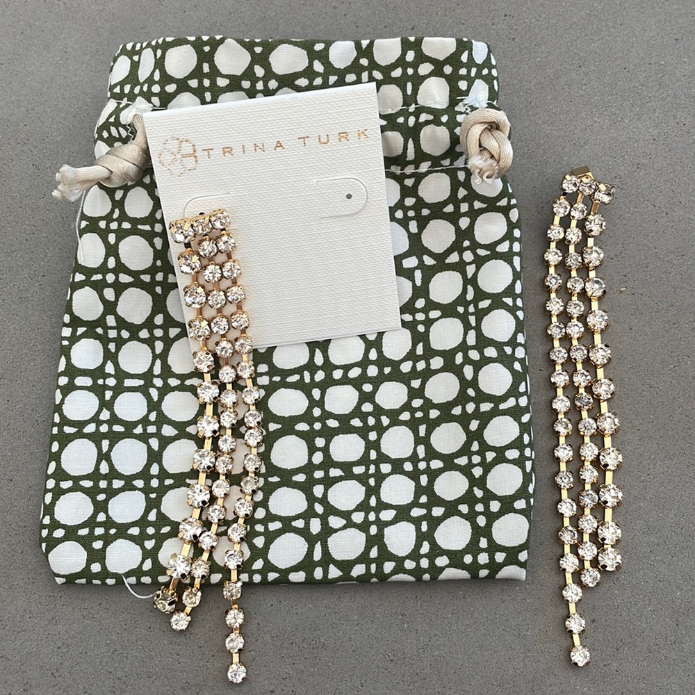 Trina Turk crystal fringe earrings with brass.